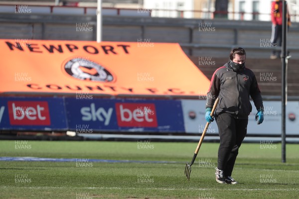 270221 - Newport County v Stevenage - Sky Bet League 2 - Ground staff at Rodney Parade tend to the pitch before kick off