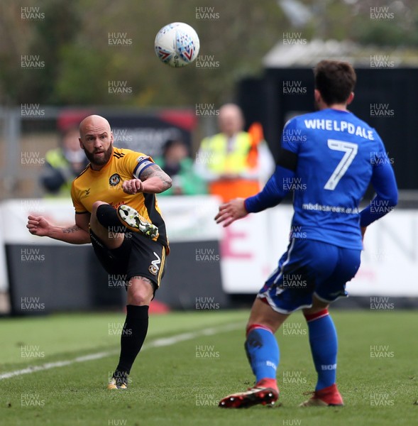 070418 - Newport County v Stevenage FC - SkyBet League Two - David Pipe of Newport County kicks the ball past Chris Whelpdale of Stevenage