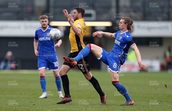 070418 - Newport County v Stevenage FC - SkyBet League Two - Ben Tozer of Newport County is challenged by Ben Sheaf of Stevenage