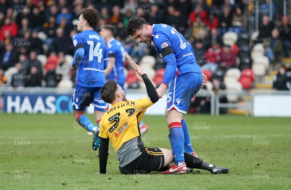 070418 - Newport County v Stevenage FC - SkyBet League Two - Josh Sheehan of Newport County is dragged up by Ron Henry of Stevenage