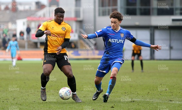 070418 - Newport County v Stevenage FC - SkyBet League Two - Tyler Reid of Newport County is tackled by Luke Amos of Stevenage