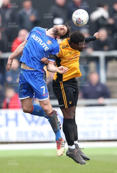 070418 - Newport County v Stevenage FC - SkyBet League Two - Chris Whelpdale of Stevenage and Tyler Reid of Newport County go up for the ball