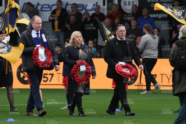 121122 - Newport County v Stockport County - Sky Bet League 2 - President of Stockport County Steve Ballis, Representative Jill Stephenson and Chairman of Newport County Gavin Foxhall lead the teams out