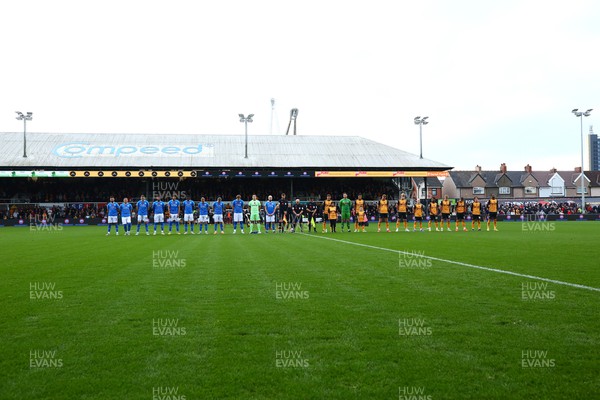 121122 - Newport County v Stockport County - Sky Bet League 2 - Players of Stockport and Newport pay their respects before kick off