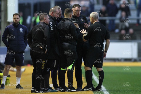 121122 - Newport County v Stockport County - Sky Bet League 2 - Manager of Newport County Graham Coughlan discusses a decision with the officials