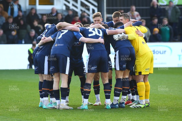 251123 - Newport County v Stockport County - Sky Bet League 2 - Newport County huddle before kick off 