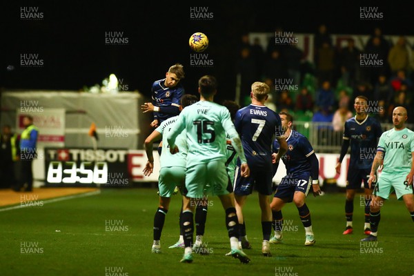251123 - Newport County v Stockport County - Sky Bet League 2 - Lewis Payne of Newport County clears a high ball
