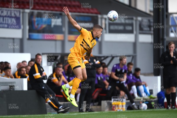 280718 - Newport County v Stoke City Under 23s - Preseason Friendly - Tyler Forbes of Newport County gets up for the ball