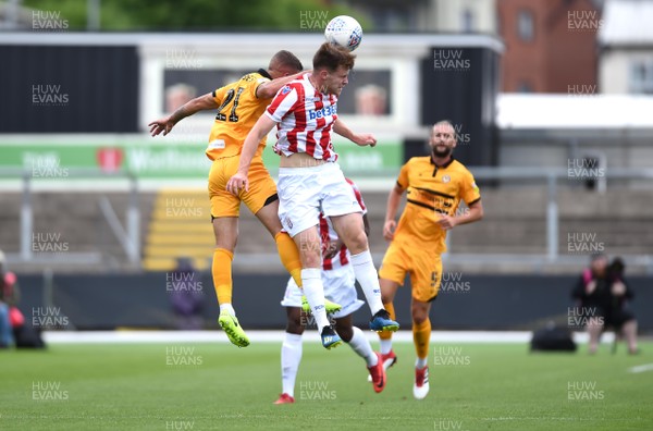 280718 - Newport County v Stoke City Under 23s - Preseason Friendly - Tyler Forbes of Newport County and Cameron Mcjannet of Stoke City U23s compete for the ball