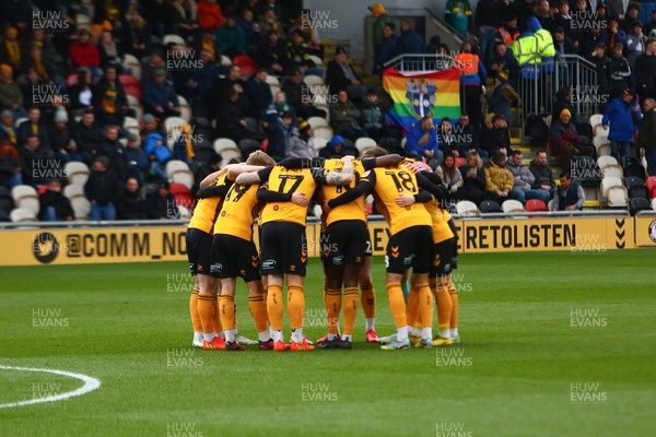 250223 - Newport County v Sutton United - Sky Bet League 2 - Players of Newport County huddle before kick off