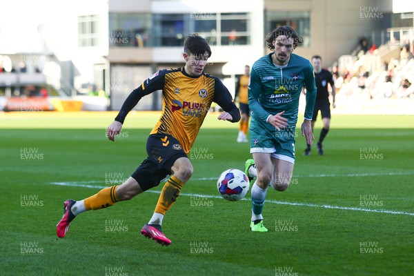 250223 - Newport County v Sutton United - Sky Bet League 2 - Will Evans of Newport County takes on Sam Hart of Sutton United