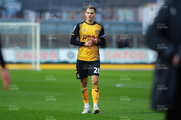 250223 - Newport County v Sutton United - Sky Bet League 2 - Mickey Demetriou of Newport County is dejected at he end of the game