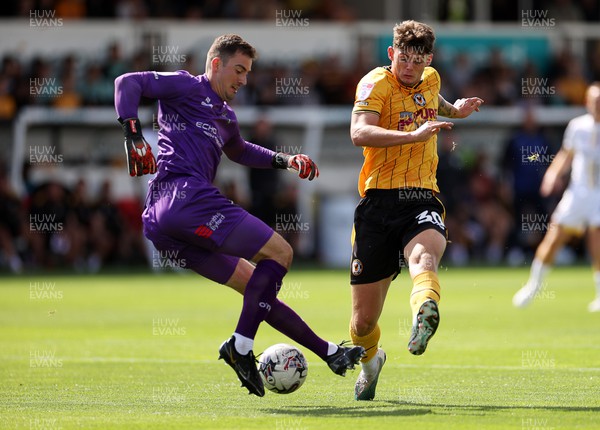 260823 - Newport County v Sutton United - SkyBet League Two - Jack Rose of Sutton United is challenged by Seb Palmer-Houlden of Newport County 