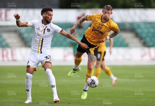 260823 - Newport County v Sutton United - SkyBet League Two - Lee Angol of Sutton United is challenged by Scot Bennett of Newport County 