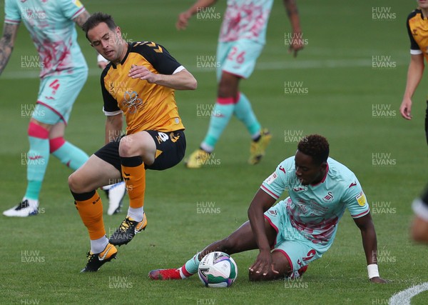 050920 - Newport County v Swansea City - Carabao Cup - Matthew Dolan of Newport County is tackled by Jamal Lowe of Swansea City