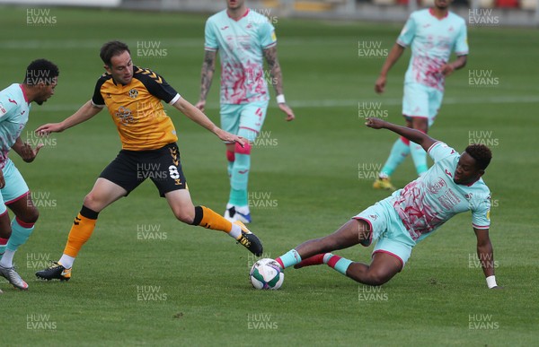 050920 - Newport County v Swansea City - Carabao Cup - Matthew Dolan of Newport County is tackled by Jamal Lowe of Swansea City