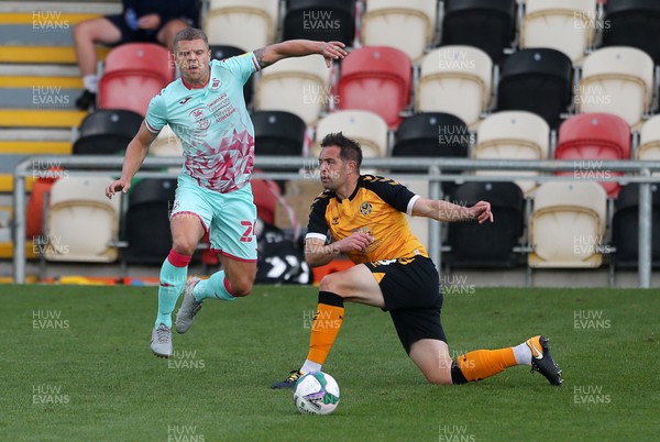 050920 - Newport County v Swansea City - Carabao Cup - Jake Bidwell of Swansea City is tackled by Matthew Dolan of Newport County
