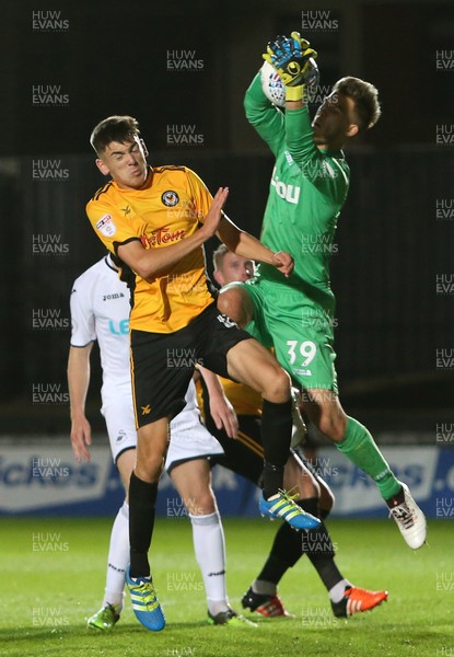 101017 - Newport County v Swansea City U23s - Checkatrade Trophy - Jay Foulston of Newport County can't beat keeper Gregor Zabret of Swansea City to the ball