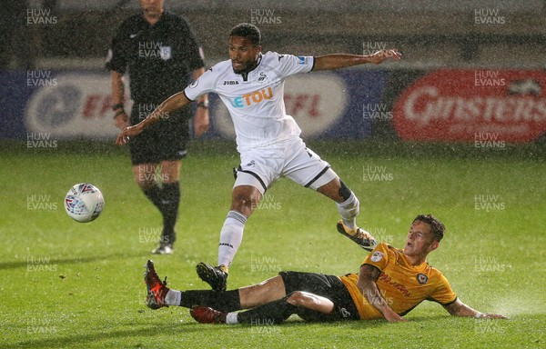 101017 - Newport County v Swansea City U23s - Checkatrade Trophy - Kenji Gorre of Swansea City is tackled by Ben White of Newport County
