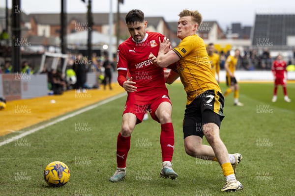 030224 - Newport County v Swindon Town - Sky Bet League 2 - Will Evans of Newport County in action against Conor McCarthy of Swindon Town