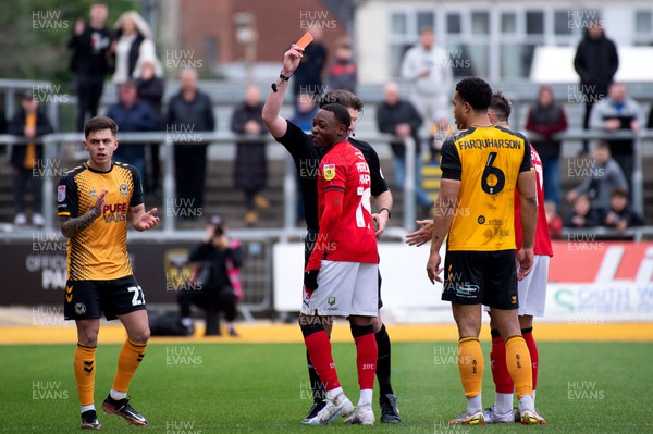 040223 - Newport County v Swindon Town - Sky Bet League 2 - Rushian Hepburn-Murphy of Swindon Town is sent off by referee Neil Hair for a push on Cameron Norman of Newport County 