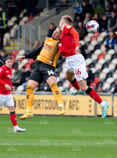 040223 - Newport County v Swindon Town - Sky Bet League 2 - Aaron Lewis of Newport County and Jake Cain of Swindon Town challenge for the ball