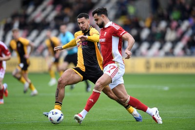 041025 - Newport County v Swindon Town - Sky Bet League 2 - Courtney Baker-Richardson of Newport County is challenged by Ryan Tafazolli of Swindon