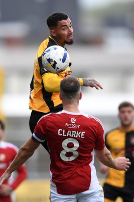 041025 - Newport County v Swindon Town - Sky Bet League 2 - Courtney Baker-Richardson of Newport County is challenged by Ollie Clarke of Swindon