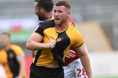 041025 - Newport County v Swindon Town - Sky Bet League 2 - Lee Jenkins of Newport County appeals after having his shirt pulled by Ollie Palmer of Swindon