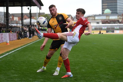 041025 - Newport County v Swindon Town - Sky Bet League 2 - Lee Jenkins of Newport County is challenged by Ollie Clarke of Swindon