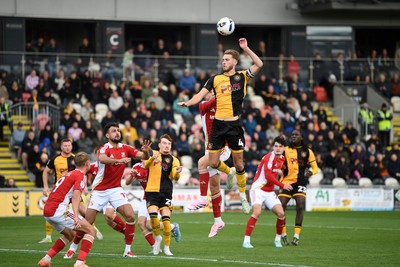 041025 - Newport County v Swindon Town - Sky Bet League 2 - Matthew Baker of Newport County heads at goal