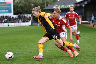 041025 - Newport County v Swindon Town - Sky Bet League 2 - Sam Braybrooke of Newport County is challenged by Paul Glatzel of Swindon