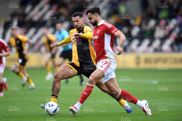 041025 - Newport County v Swindon Town - Sky Bet League 2 - Courtney Baker-Richardson of Newport County is challenged by Ryan Tafazolli of Swindon