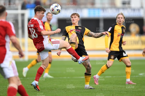041025 - Newport County v Swindon Town - Sky Bet League 2 - Kai Whitmore of Newport County is challenged by Gavin Kilkenny of Swindon