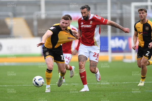 041025 - Newport County v Swindon Town - Sky Bet League 2 - Lee Jenkins of Newport County is challenged by Ollie Palmer of Swindon