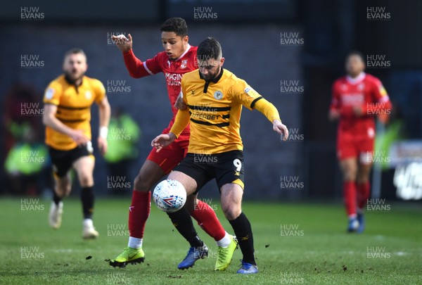 090419 - Newport County v Swindon Town - SkyBet League 2 - Padraig Amond of Newport County is tackled by Kyle Knoyle of Swindon Town
