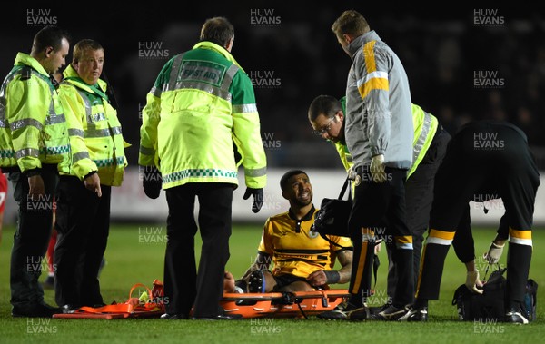 090419 - Newport County v Swindon Town - SkyBet League 2 - Joss Labadie of Newport County is stretchered off with an injury