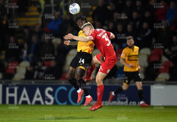 090419 - Newport County v Swindon Town - SkyBet League 2 - Adebayo Azeez of Newport County and Owen Taylor of Newport County comets for the ball
