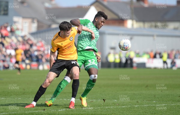 140418 - Newport County v Swindon Town - SkyBet League 2 - Aaron Collins of Newport County and Rollin Menayese of Swindon Town compete