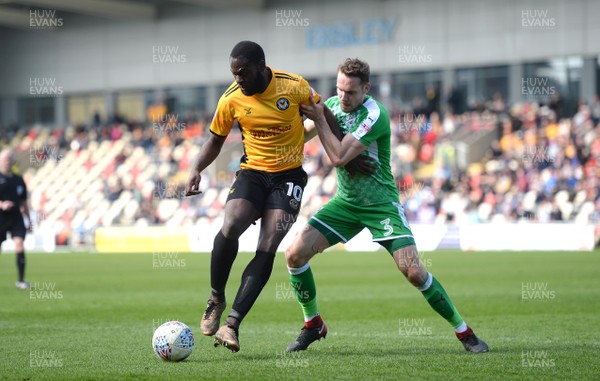 140418 - Newport County v Swindon Town - SkyBet League 2 - Frank Nouble of Newport County is tackled by Chris Hussey of Swindon Town