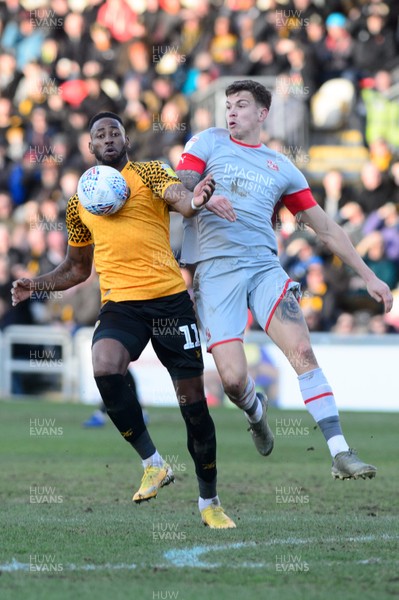 180120 - Newport County v Swindon Town - Sky Bet League 2 - Jamille Matt of Newport County and Tom Broadbent of Swindon Town compete for the ball