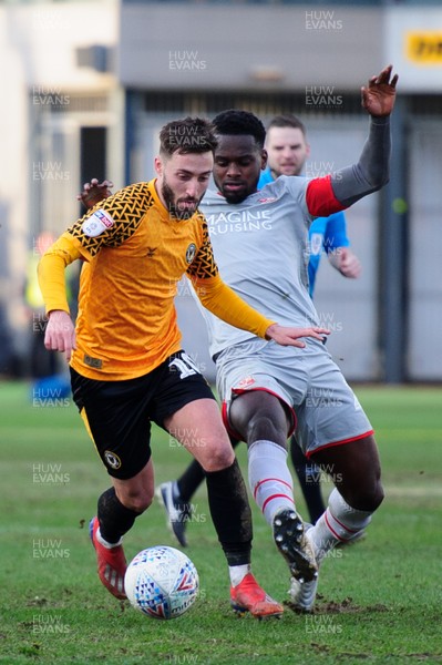 180120 - Newport County v Swindon Town - Sky Bet League 2 - Josh Sheehan of Newport County is tackled by  Diallang Jaiyesimi of Swindon Town