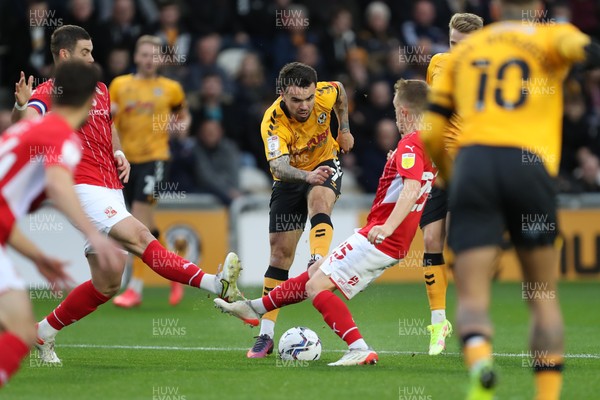 201121 - Newport County v Swindon Town - Sky Bet League 2 - Dom Telford of Newport County has a shot blocked by the Swindon Town defence