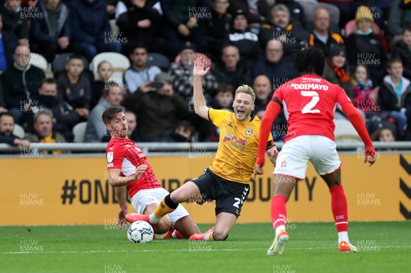 201121 - Newport County v Swindon Town - Sky Bet League 2 - Cameron Norman of Newport County is brought down on the edge of the Swindon penalty area 