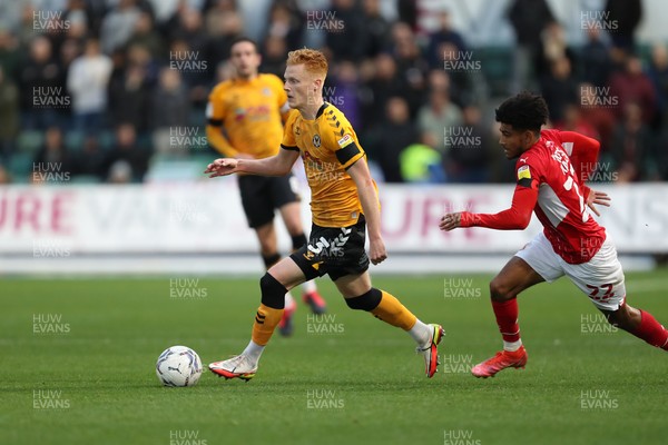 201121 - Newport County v Swindon Town - Sky Bet League 2 - Ryan Haines of Newport County is chased by Kaine Kesler Hayden of Swindon Town