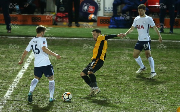 270118 - Newport County v Tottenham Hotspur - FA Cup - Robbie Willmott of Newport County is tackled by Eric Dier of Tottenham Hotspur