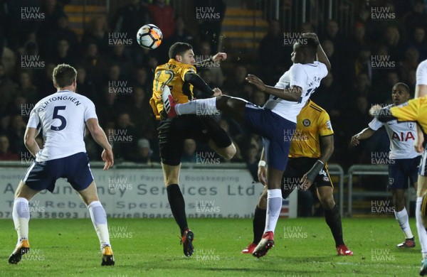 270118 - Newport County  v Tottenham Hotspur, Emirates FA Cup Fourth Round - Ben Tozer of Newport County and Victor Wanyama of Tottenham Hotspur compete for the ball