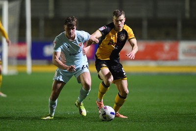 030326 - Newport County v Tranmere Rovers - Sky Bet League 2 - Sven Sprangler of Newport County is challenged by James Plant of Tranmere