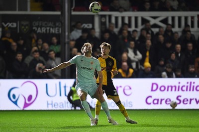 030326 - Newport County v Tranmere Rovers - Sky Bet League 2 - Michael Spellman of Newport County is challenged by Patrick Brough of Tranmere