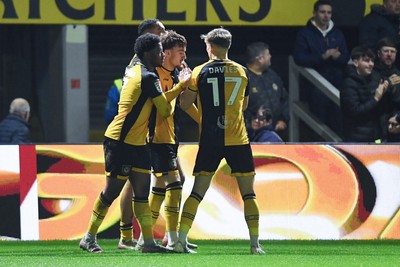 030326 - Newport County v Tranmere Rovers - Sky Bet League 2 - Michael Spellman of Newport County celebrates scoring a goal with team mates